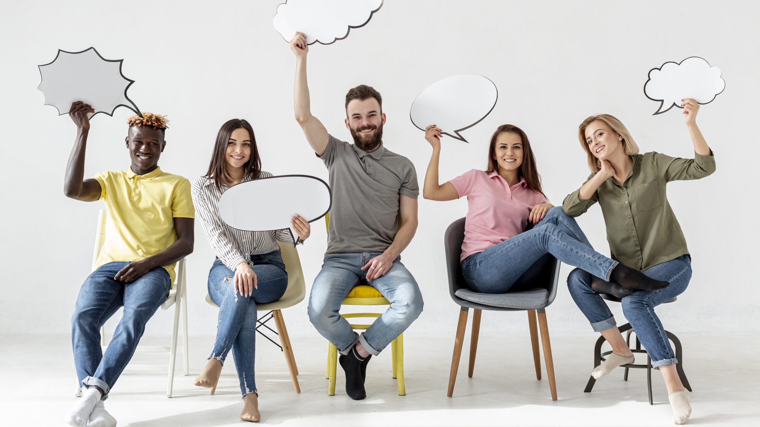 Low angle friends chairs with chat bubbles